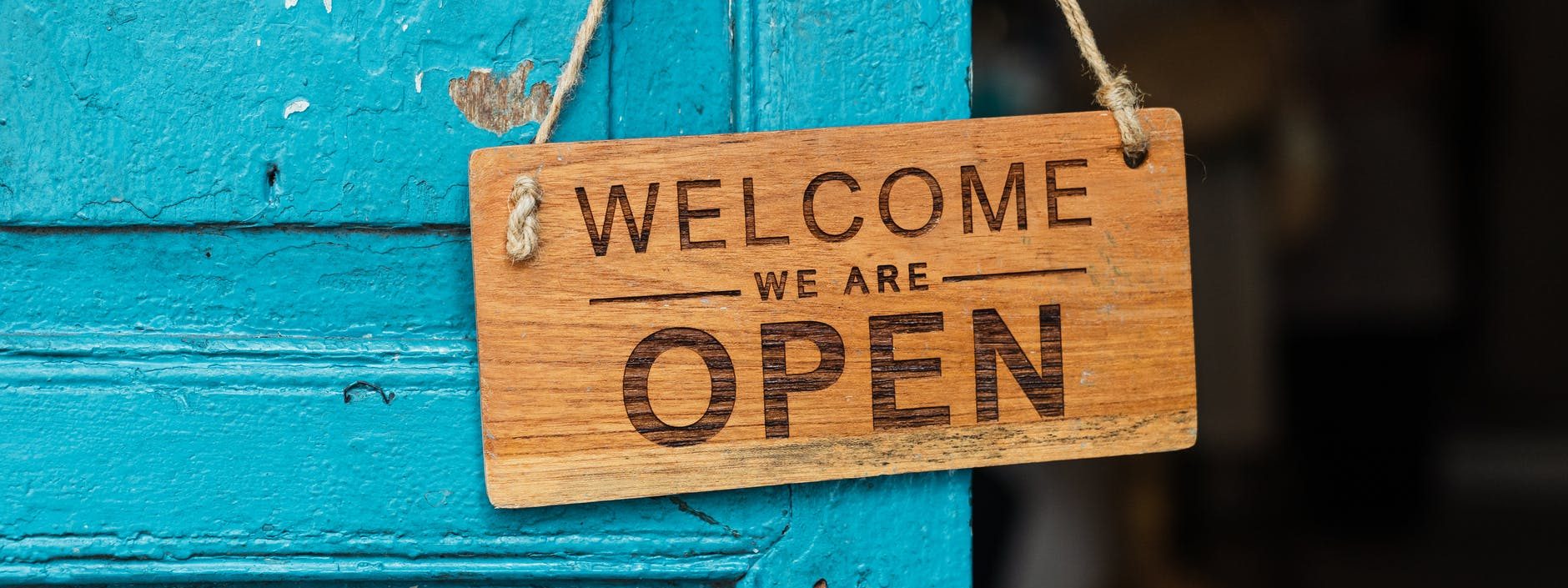wooden welcome signage